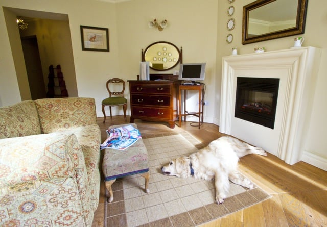 Rathmullan-House-Suz-in-front-of-Fire